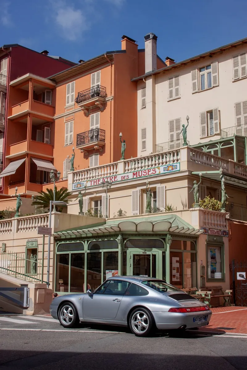 A classic car outside a Riviera hotel