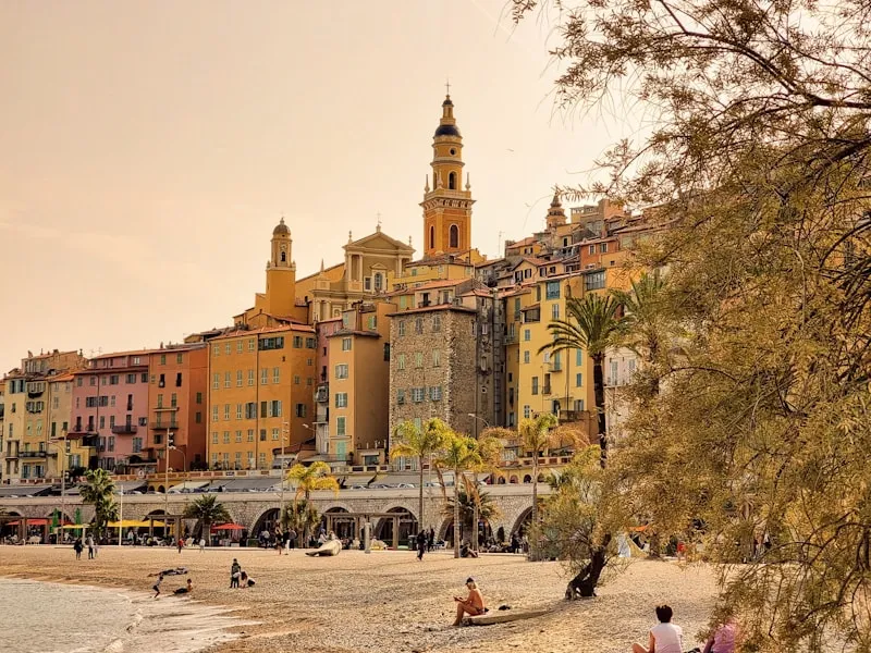 The golden facades of Menton above the beach