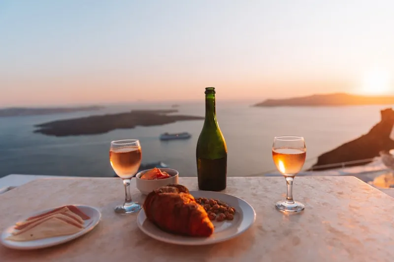 Rosé and pastries at golden hour above the sea